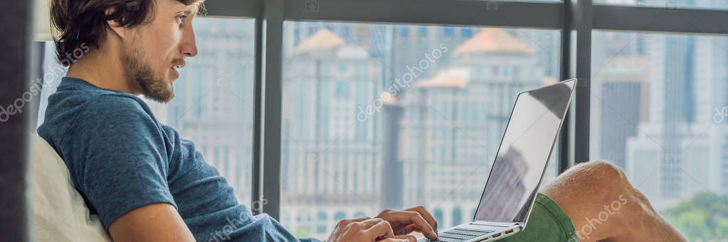 Engineer remotely configuring an energy management system from a laptop